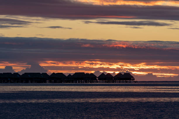 istock Overwater bungalow sunset in moorea french polynesia 1074334532