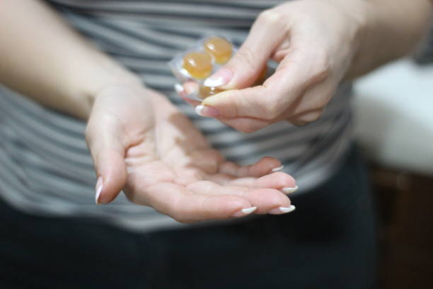 istock woman with pills and medicines 1074342240