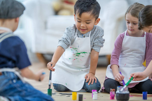 istock Children painting 1074374848