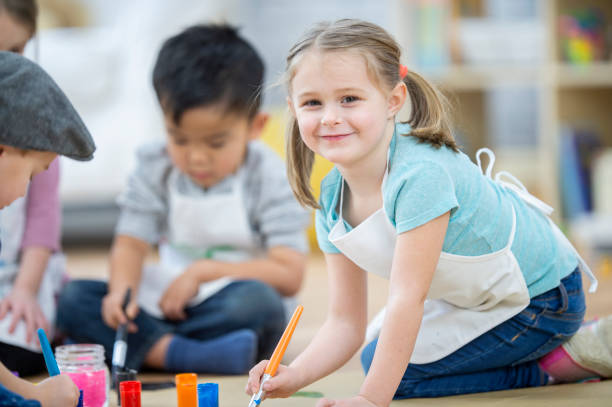 istock Little girl painting 1074374852