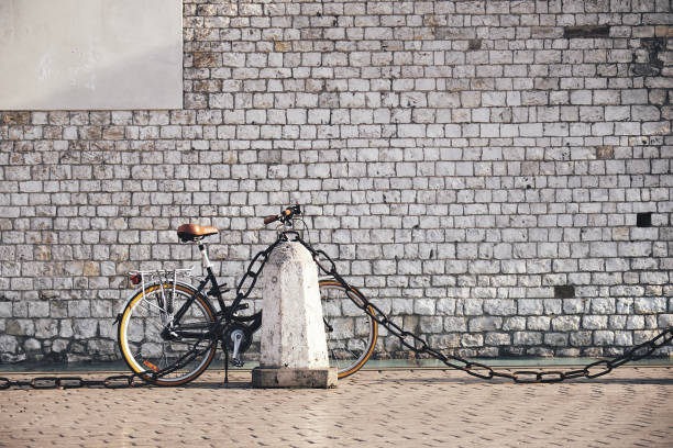 istock bicycle on the background of a stone wall 1074391006