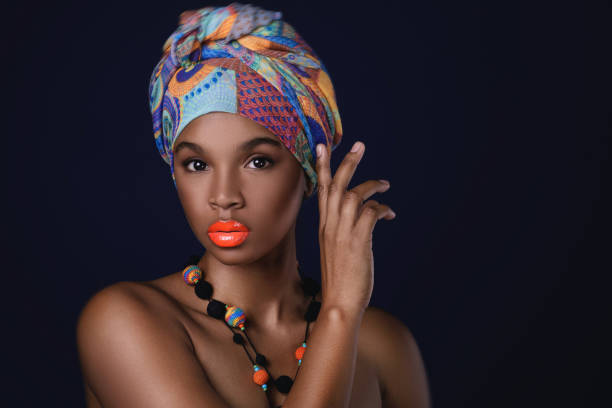 istock African woman with a colorful shawl on her head 1074392006