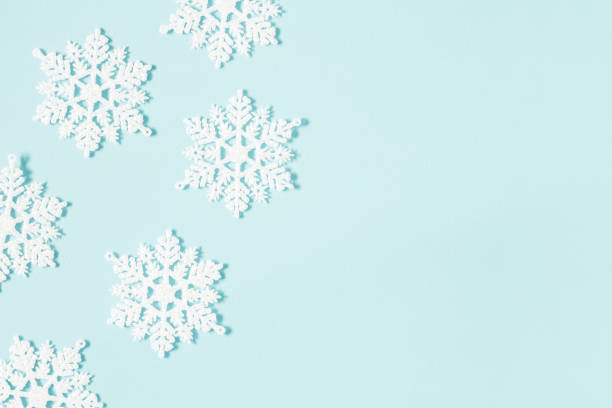 istock Christmas or winter composition. Pattern made of snowflakes on pastel blue background. Christmas, winter, new year concept. Flat lay, top view, copy space 1074400798