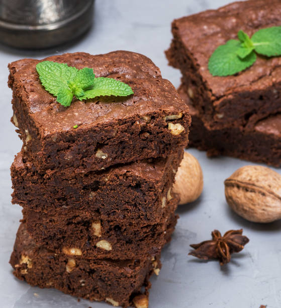 istock stack of baked square pieces of chocolate brownie pie with walnuts 1074422502