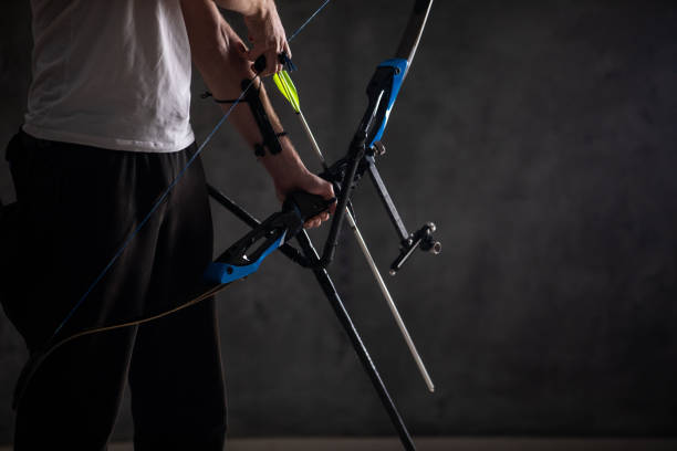 istock Unrecognizable man with bow and arrow 1074428946