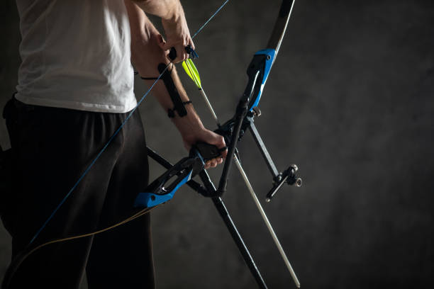 istock Bow and arrow in hands 1074428950