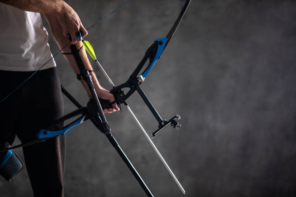 istock Archery equipment in human hands 1074428978