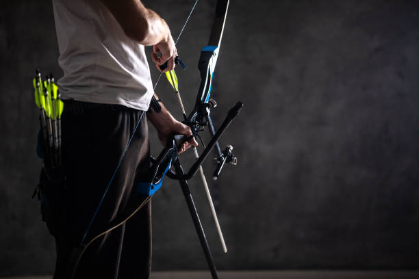 istock Archery equipment in human hands 1074428980