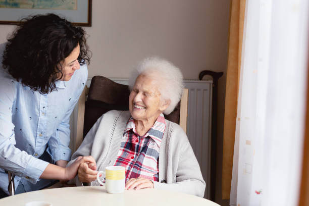 Senior woman getting care and assistance stock photo