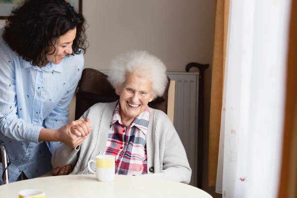 istock Senior woman getting care and assistance 1074436198