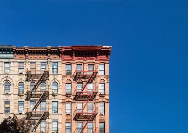 Blue sky above old building in NYC Colorful historic buildings on 4th Street in the East Village of Manhattan in New York City with empty blue sky background historic building photos stock pictures, royalty-free photos & images