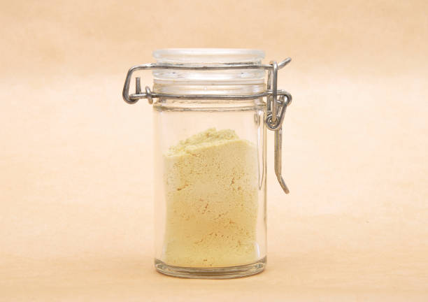Lupin flour in closed jar on brown background