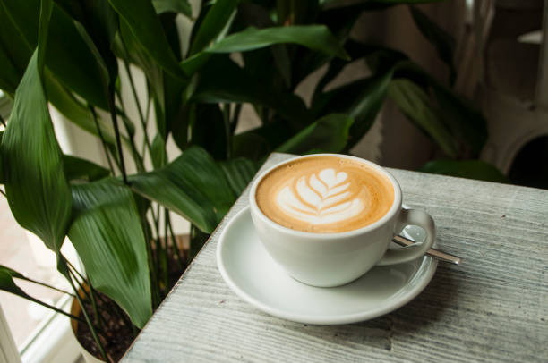 istock A cup of coffee in a cafe with beautiful latte art. 1074457452