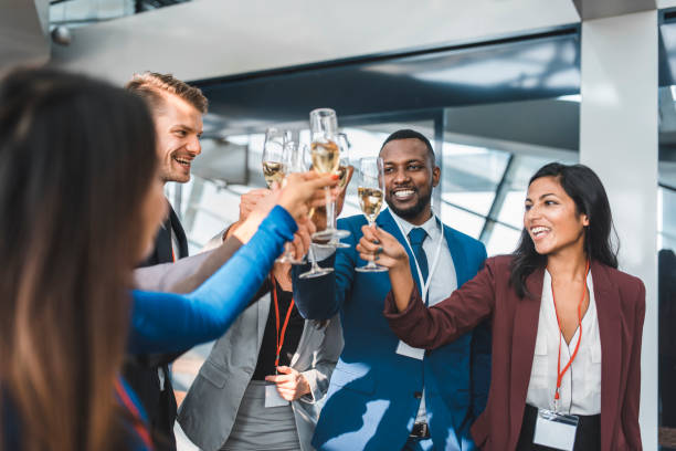 istock Multi ethnic group of businesspeople celebrating with champagne at work 1074463056