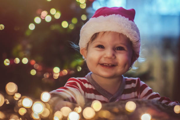 istock Cute boy indoors near Christmas tree 1074464096