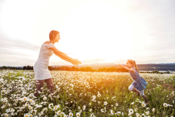 istock Mother spending time with daughter during the sunset. 1074464690