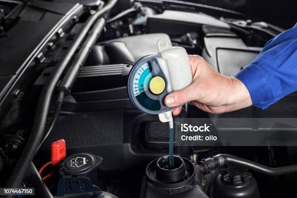Checking The Radiator Antifreeze Stock Photo - Download Image Now - Coolant, Car, Cold Temperature
