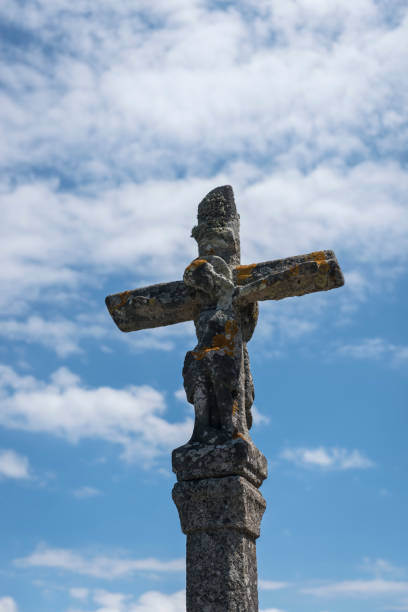 istock Old stone cross against sky in Finisterre, Spain 1074486582