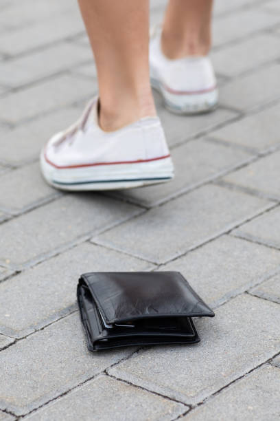 istock Lost leather wallet on the ground 1074500566