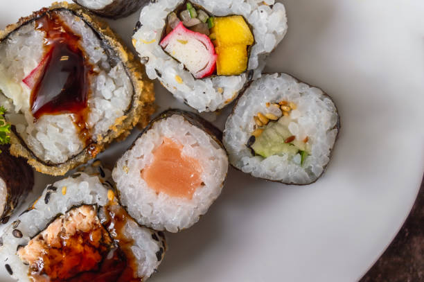 istock Uramaki and Hot Roll on a plate 1074507700
