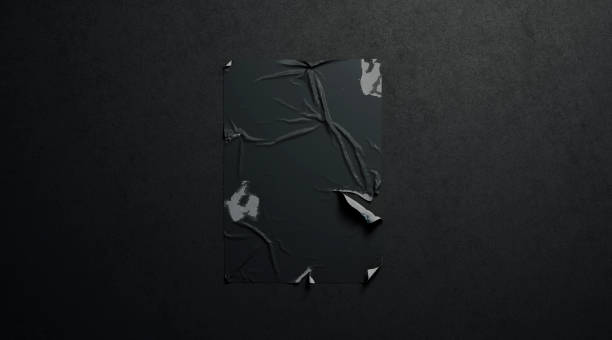 istock Blank black wheatpaste adhesive torn poster mockup dark textured wall 1074508070