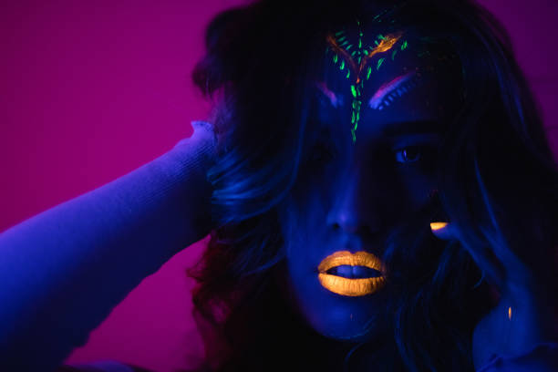 istock Woman with fluorescent makeup 1074523752