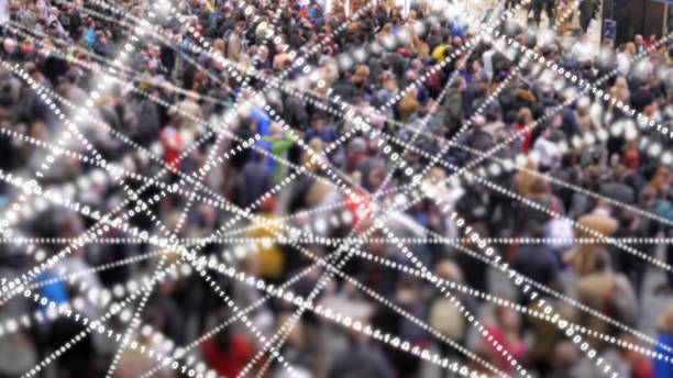 istock Crowd of people with streams of data flying around. 1074532652