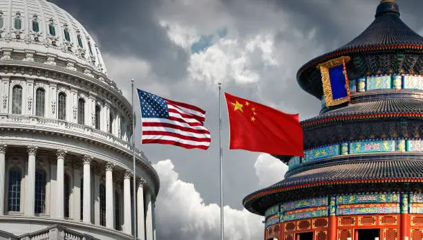 US and Chinese national symbols: The Capitol in Washington DC and Temple of Heaven in Beijing with national flags