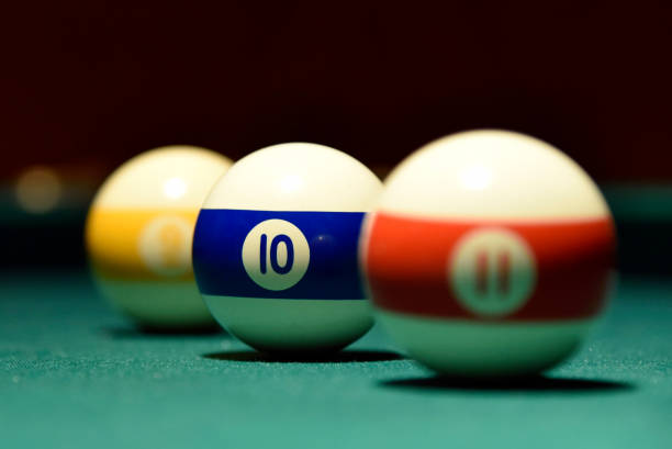 istock Billiard balls and cue on the pool table pool, ball, table 1074535362