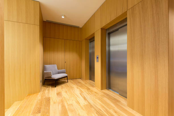 istock Hotel entrance, elevators in wooden corridor 1074537904