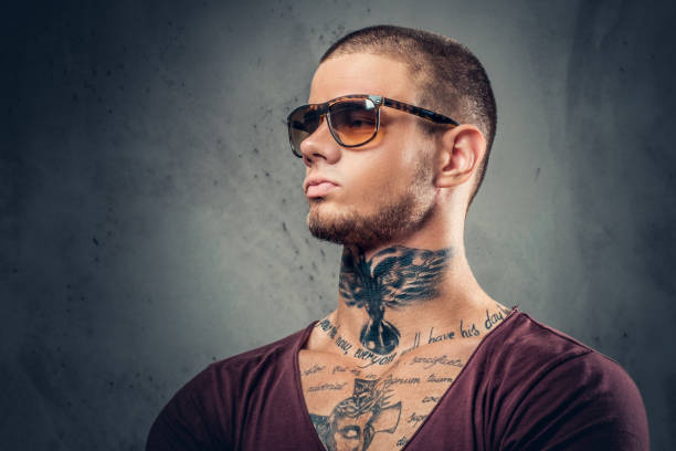 istock Tattooed male over grey background in a studio. 1074540276
