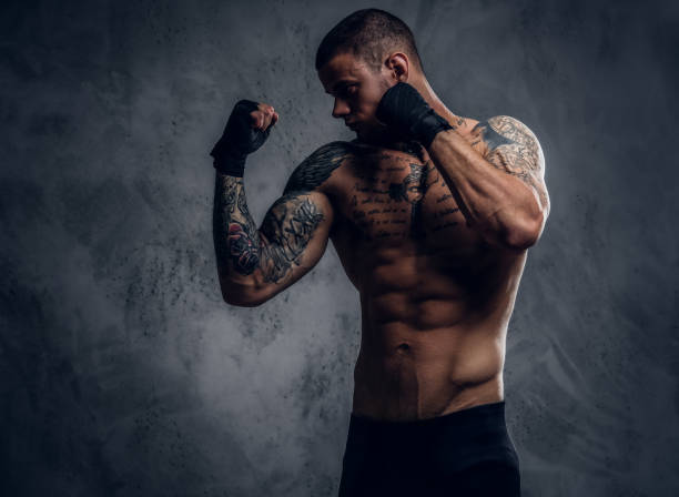 istock Fighter male over grey vignette background. 1074543426