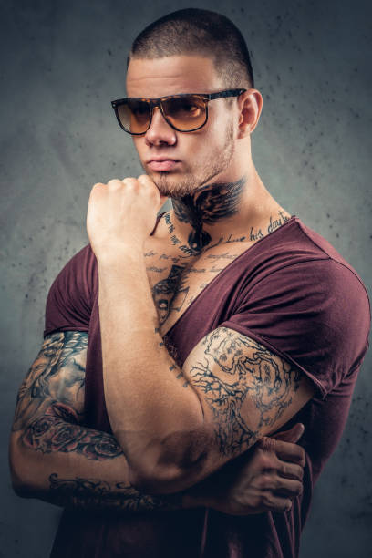 istock Tattooed male over grey background in a studio. 1074547446