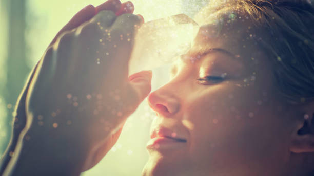 istock Woman's head with a healing crystal. 1074563894