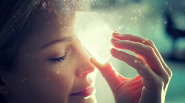 istock Woman's head with a healing crystal. 1074564972