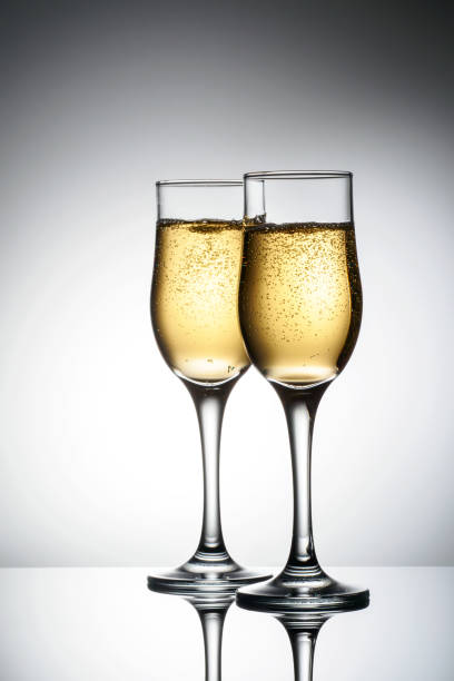 istock Two elegant glasses with sparkling champagne 1074596164