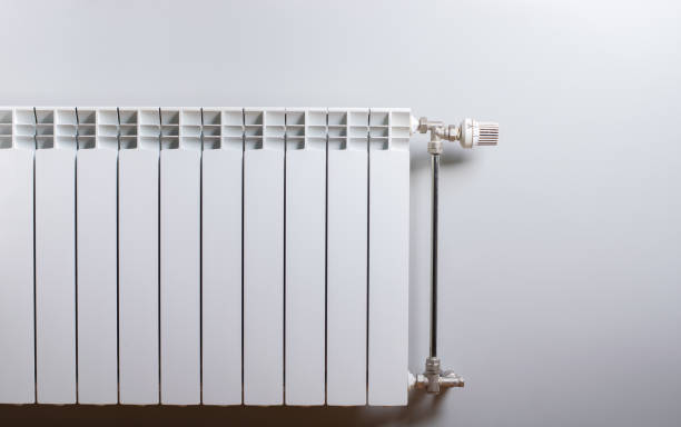istock A White heating radiator on the wall. 1074597362