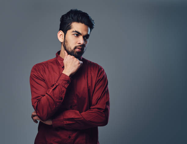 istock An Indian male dressed in a red shirt. 1074611402