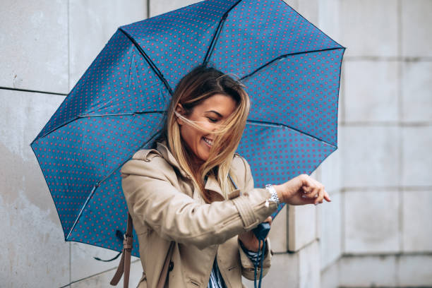istock Happy woman on a rainy day 1074619680