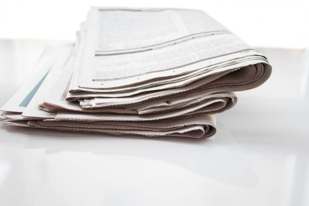 istock Newspapers folded and stacked concept for global communications 1074624734