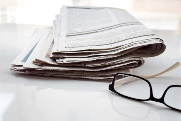 istock Newspapers folded and stacked concept for global communications 1074624776