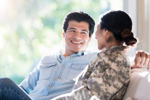 istock Young woman in uniform sits with a man 1074625190