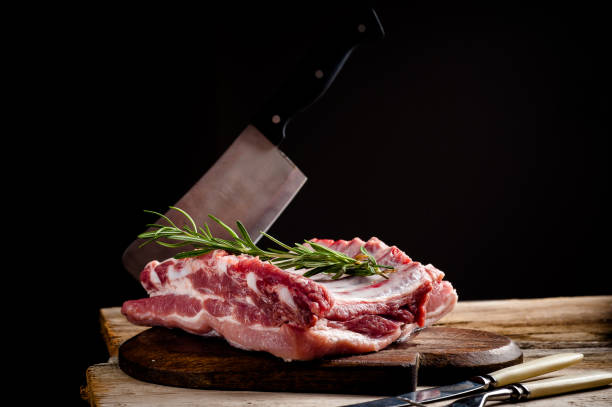 fresh meat on a wooden board. Steak, ribs polar bear, heel