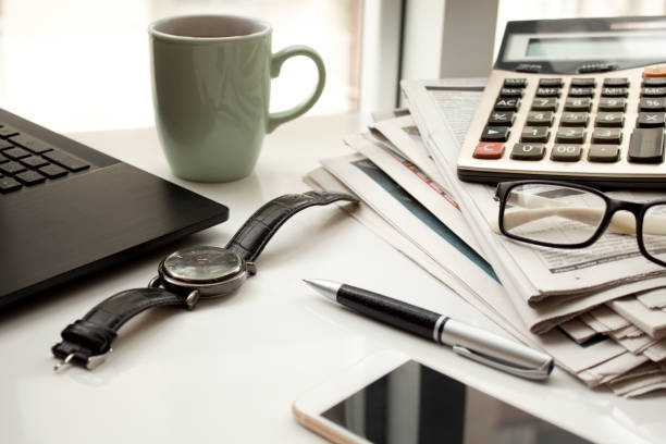 istock Business table with laptop and coffee 1074629398