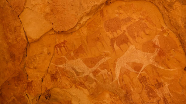 Cave paintings and petroglyphs in Bichagara Cave camel, cow , Ennedi, Chad Cave paintings and petroglyphs in Bichagara Cave camel, cow in Ennedi, Chad ennedi massif photos stock pictures, royalty-free photos & images
