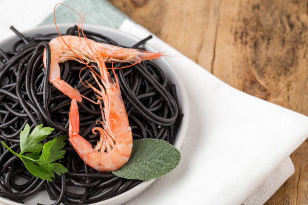 istock Black spaghetti with prawns. Homemade. 1074630488