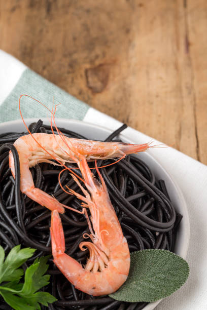 istock Black spaghetti with prawns. Homemade. 1074630504