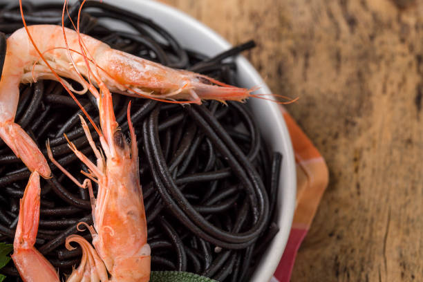 istock Black spaghetti with prawns. Homemade. 1074630510