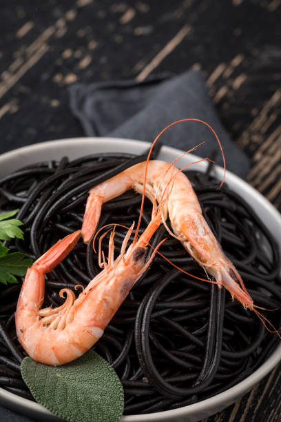 istock Black spaghetti with prawns. Homemade. 1074630530