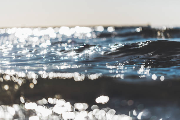 istock Sunny little waves by the beach 1074631824